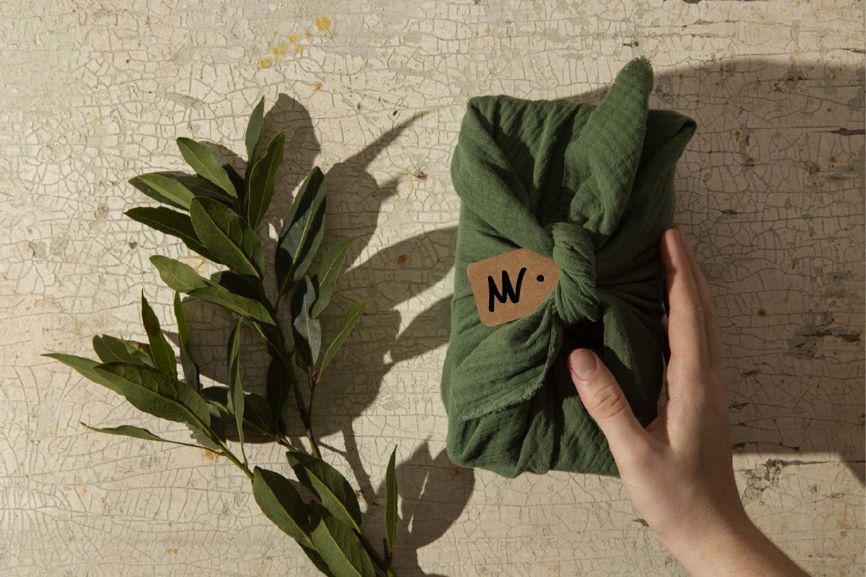 top-view-hand-holding-furoshiki-package